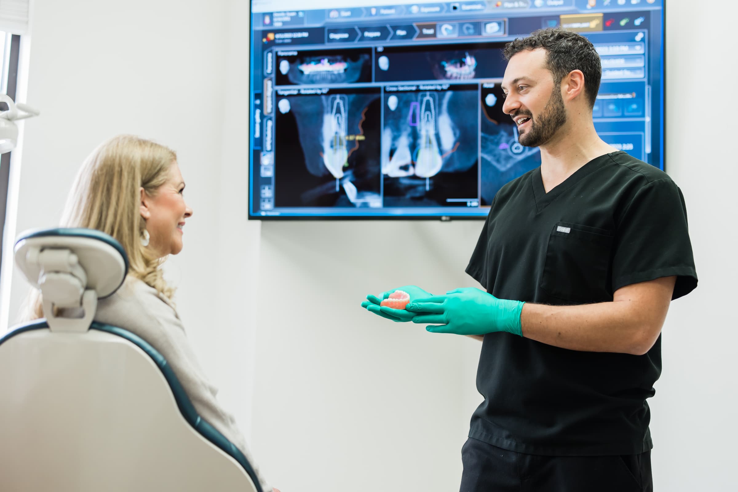 Patient reviewing a personalized veneer treatment plan and cost estimate at RealVeneers in Sugar Land, TX